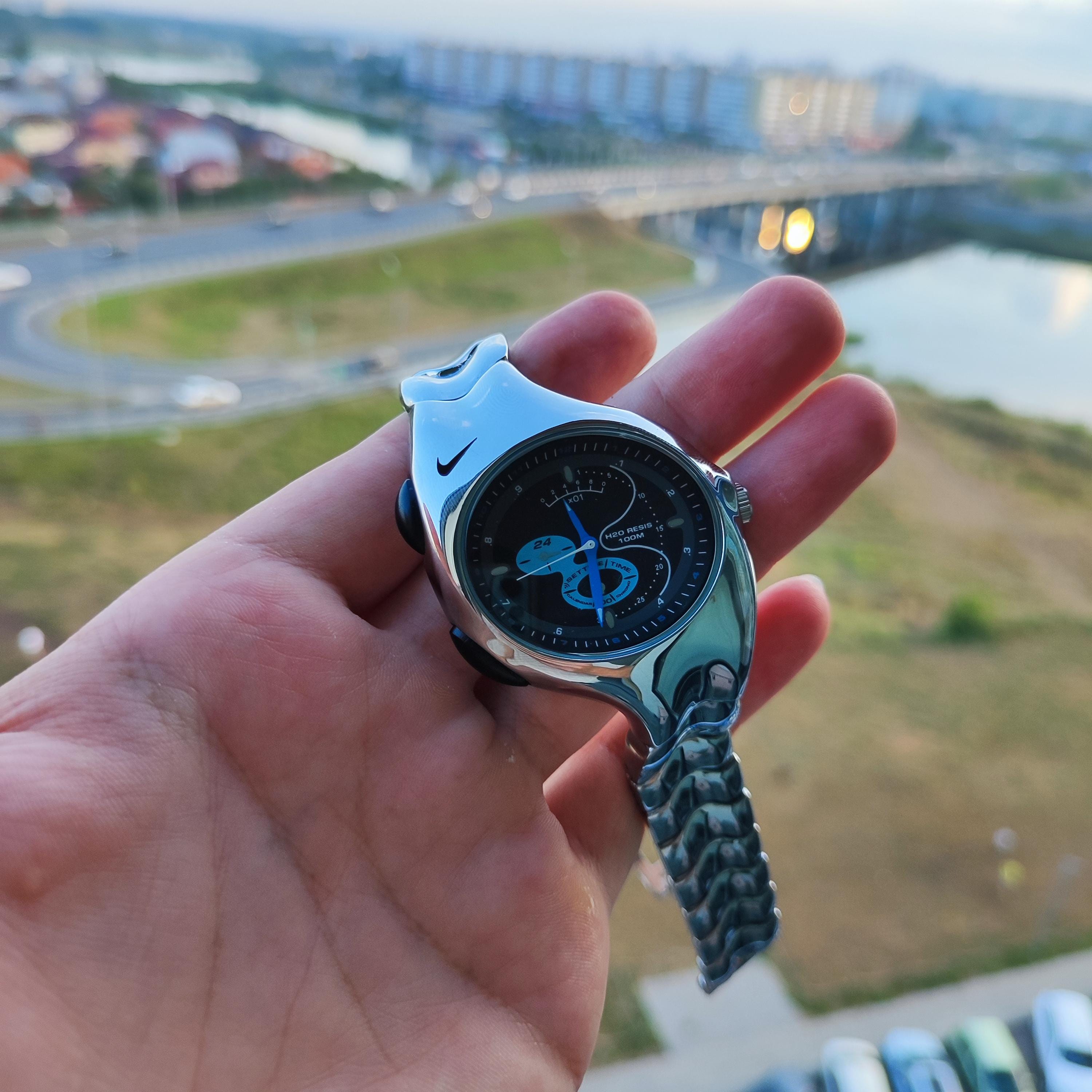 Futurist Chrome Curve Watch – Retro Y2K Liquid Metal Style by Nike