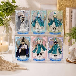 May include: A clear acrylic display stand holding six anime character figures. Each figure is on a clear base and features a character in a unique outfit, with a matching background. The figures are in a variety of poses.