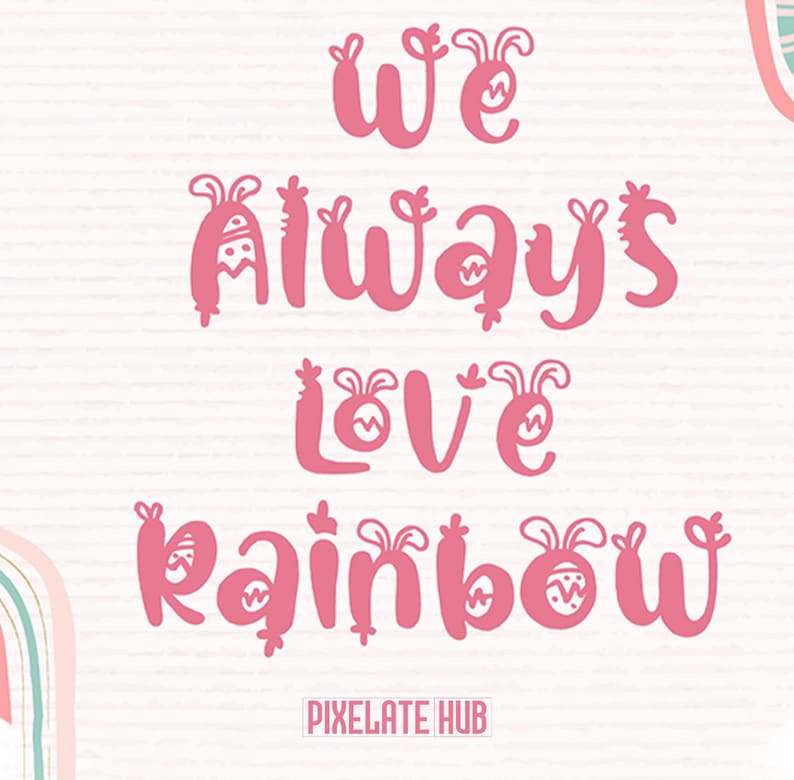 K&ouml;nnte beinhalten: Rosa Text auf wei&szlig;em Hintergrund: "We Always Love Rainbow". Die Buchstaben in einer verspielten Schriftart sind mit Hasenohren verziert. Das Pixelate Hub-Logo befindet sich unten.