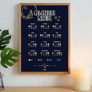 May include: A framed dark blue lunar calendar print with gold detailing. The calendar, titled "CALENDRIER LUNAIRE", shows moon phases for each month of 2026. The print has a gold frame and features a celestial design with stars and a crescent moon.