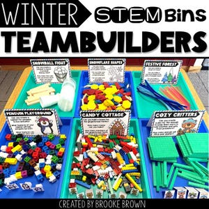May include: A display of Winter STEM Bins TeamBuilders with various building materials. The bins include themes like Snowball Fight, Snowflake Shapes, Penguin Playground, Candy Cottage, Festive Forest, and Cozy Critters. Each bin has a sign with instructions.