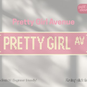 Puede incluir: Un diseño de punto de cruz rosa y crema de una señal de calle que dice "PRETTY GIRL AV". Las palabras "Pretty Girl Avenue" están encima del letrero. También se ve el texto "pdf digital download", "No backstitch! | Beginner friendly!" y "Piesling stitch face".