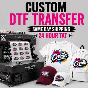 May include: A DTF transfer printing setup with a large printer and oven. The image shows a white t-shirt, backpack, and two caps, all with a colorful "Create" design. Text includes "Custom DTF Transfer" and "24 Hour TAT".