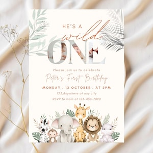 May include: A birthday invitation with a safari theme. The invitation features the text "He's a Wild One" and "Peter's First Birthday". The bottom of the invitation has illustrations of safari animals, including a zebra, elephant, giraffe, and lion.