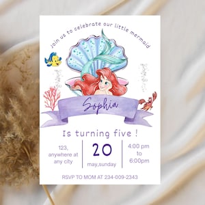 May include: A birthday invitation featuring a watercolor illustration of a mermaid with red hair, a blue tail, and a seashell. The invitation includes the text "Join us to celebrate our little mermaid" and "Sophia is turning five!"