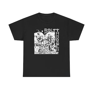 May include: Black t-shirt featuring a white graphic design. The design includes the band name "BOLT THROWER" in a vertical font, along with an illustration and the text "IN BATTLE THERE'S NO LAW!"
