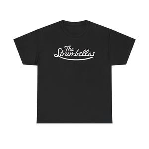 May include: Black t-shirt with the white text "The Strumbellas" in a cursive font. The text is centered on the front of the shirt. The shirt is a crew neck style.