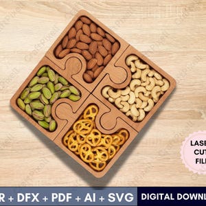 Op de afbeelding: Een houten serveerschaal in puzzelvorm gevuld met amandelen, pistachenoten, cashewnoten en pretzels. De schaal is gemaakt van lichtgekleurd hout en heeft een lasergesneden bestand ontwerp. De tekst "CDR + DFX + PDF + AI + SVG DIGITAL DOWNLOAD" staat onderaan.