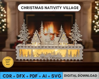 Op de afbeelding: Een lasergesneden kerststal. De witte houten display heeft uitgesneden bomen, huizen en een rendierscène, met de woorden "Merry Christmas" eronder. De tekst "Christmas Nativity Village" staat bovenaan.