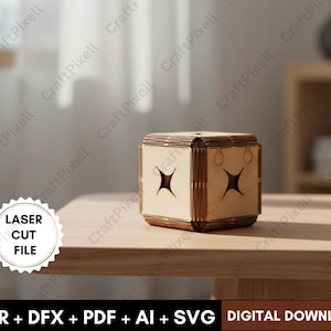 May include: A laser-cut wooden box with a cube shape, featuring star-shaped cutouts on the sides. The box is made of light brown wood and has a lid. The image also includes the text "LASER CUT FILE" and "DIGITAL DOWNLOAD".