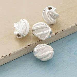 4 of Karen Hill Tribe Silver Twist Oval Beads 7x8 mm. :ka3566