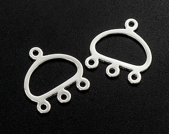 May include: Two silver-toned metal connector pieces with a rounded oval shape and five loops for attaching jewelry or other findings.