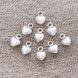 925スターリングシルバーオーキッドチャーム 10 x 11 mm 2個。:th2704
