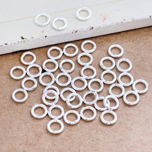 50 of 925 Sterling Silver Closed Jump Rings 5 mm., 18 AWG. :th0318 image 1