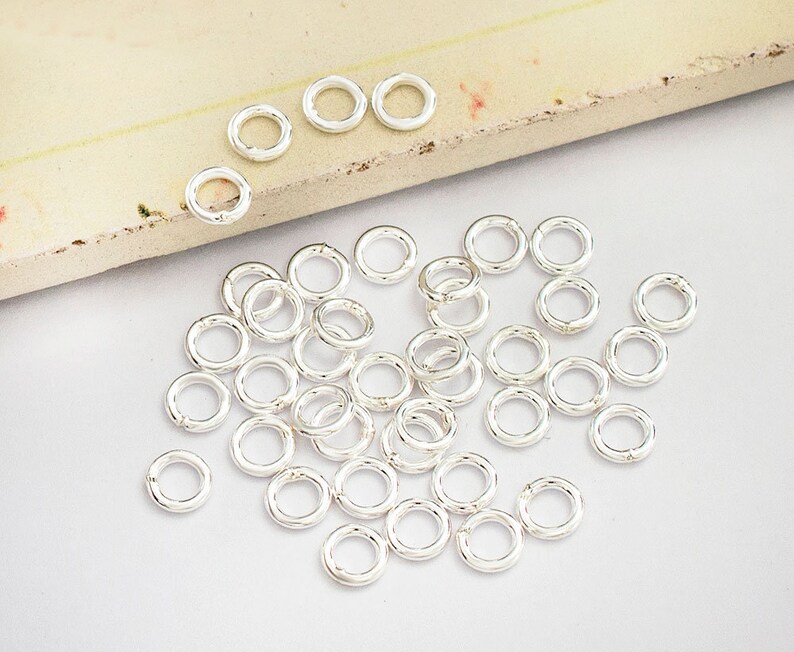50 of 925 Sterling Silver Closed Jump Rings 5 mm., 18 AWG. :th0318 image 3