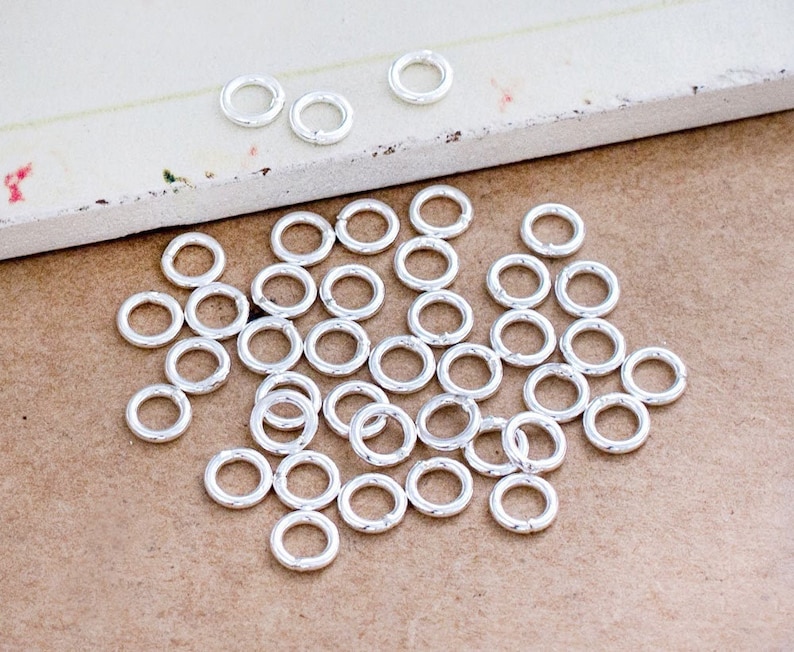 50 of 925 Sterling Silver Closed Jump Rings 5 mm., 18 AWG. :th0318 image 1