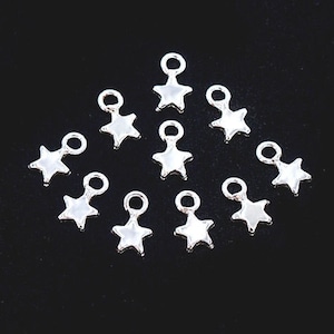 10 of 925 Sterling Silver Star Charms 4mm. , tiny charms   :th2557