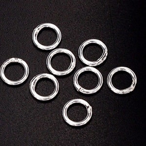 30 of 925 Sterling Silver Closed Jump Rings 6 mm. :th0319