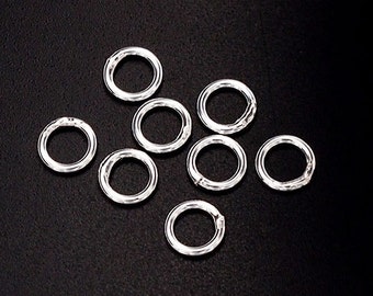 30 of 925 Sterling Silver Closed Jump Rings 6 mm. :th0319