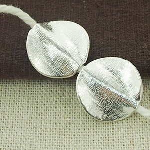 2 of Karen Hill Tribe Silver Textured Twisted Disc Beads 17 mm. :ka4182