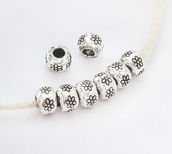 Karen hill tribe Plata 6 con flores estampadas Rondelle Cuentas 8x6mm.