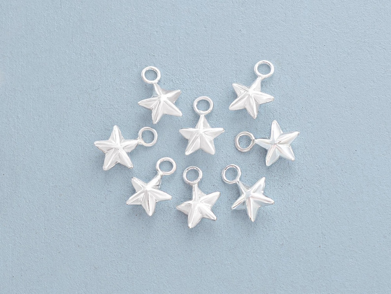 10 of 925 Sterling Silver Star Charms 6 mm. :th0744 image 1