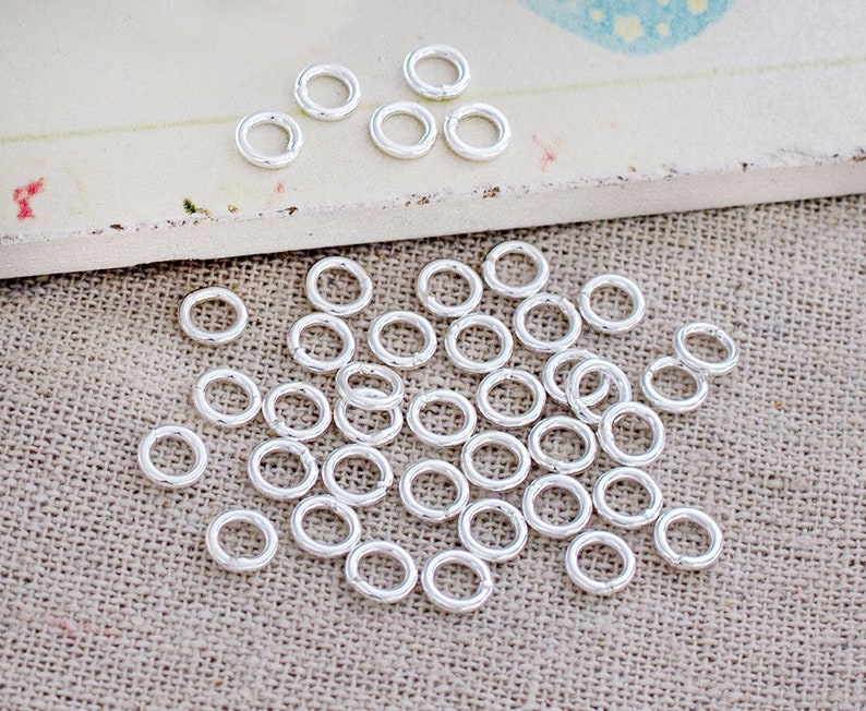 50 of 925 Sterling Silver Closed Jump Rings 5 mm., 18 AWG. :th0318 image 2