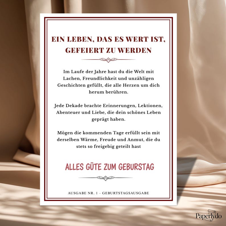 May include: A birthday card with a burgundy border and text in German. The card's message is about celebrating life and wishing the recipient a happy birthday. The card has a decorative design at the top and bottom.