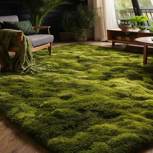 May include: A vibrant green, textured rug dominates the foreground of a living room scene. The rug's plush surface creates a soft, inviting feel. The room features a gray armchair, plants, and a wooden coffee table, creating a cozy and natural atmosphere.