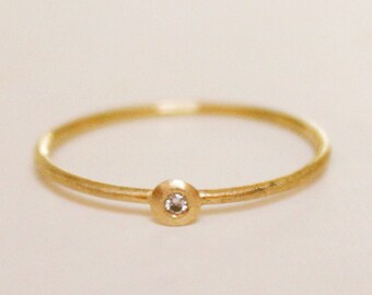 thin elegant fair trade gold ring  18k with diamond, discreet engagement ring of fairtrade gold with mini glitter diamondit