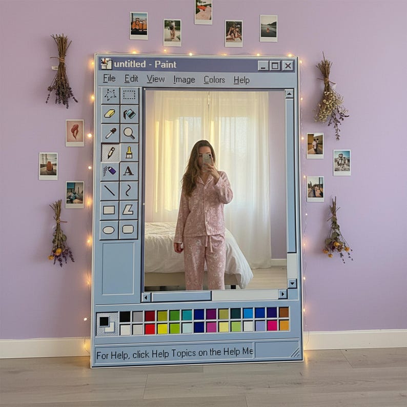 May include: A large, rectangular mirror designed to resemble a Windows Paint window, with a light blue frame and a selection of paint tools. The mirror reflects a person wearing pink pajamas. The text "untitled - Paint" is at the top.