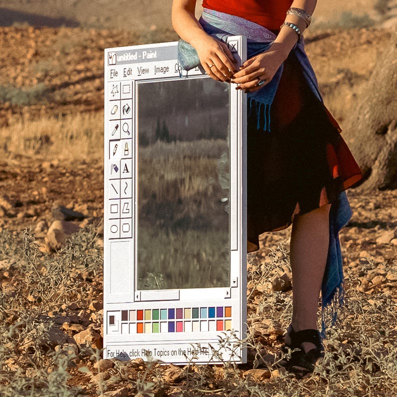 May include: A white framed mirror designed to resemble the classic Microsoft Paint application interface. The mirror includes the "untitled - Paint" title bar, menu options, and a toolbar with various drawing tools. The bottom features a color palette.