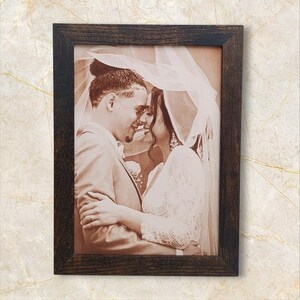 Photograph engraved into leather for a 3rd and 9th anniversary gift.