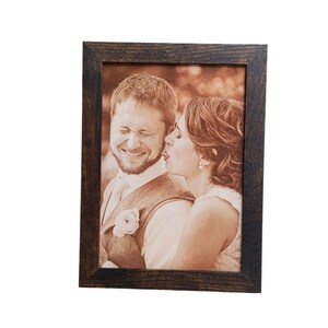 Photograph engraved into leather for a 3rd and 9th anniversary gift.