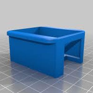 May include: A solid blue, rectangular 3D-printed object with a curved top edge and an open bottom. The object has a hollow interior and is set against a grid background.