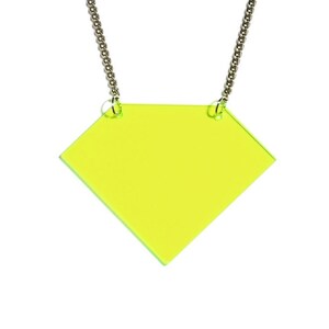 May include: A yellow diamond-shaped pendant necklace with a silver chain.