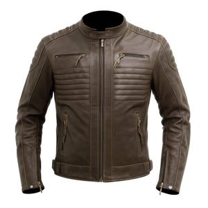 May include: A brown leather jacket with a stand-up collar and a zip-up front. The jacket has multiple zippered pockets and ribbed detailing on the shoulders and upper arms. The jacket has a classic, vintage style.