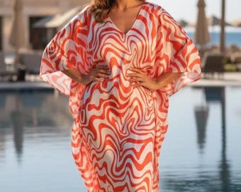 Caftan orange vif avec tourbillon psychédélique pour des tenues de plage de luxe pour les escapades au Mexique