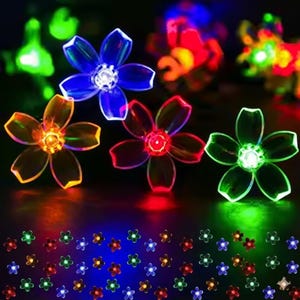 May include: A collection of illuminated flower-shaped lights in various colors, including blue, orange, red, and green. The lights are arranged in a cluster, with smaller flower lights at the bottom. The lights are suitable for decorative purposes.