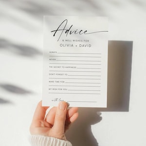 Könnte beinhalten: Eine weiße Karte mit dem Wort "Advice" in eleganter Schrift, zusammen mit Aufforderungen für Glückwünsche für Olivia und David. Die Karte enthält Zeilen, die Gäste ausfüllen können, wie "Always", "Never" und "My Wish for You".