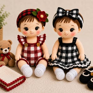 May include: Two crocheted dolls, one in a red and white checkered romper with a matching headband and a red flower, the other in a black and white checkered dress with a bow headband. A crocheted teddy bear, a crocheted blanket, and two pairs of crocheted shoes are also present.