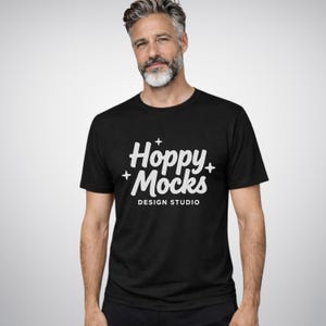 Maqueta de camiseta negra jaspeada Bella Canvas 3001 • Maqueta de estudio minimalista • Modelo masculino • Tabla de tallas ADICIONAL incluida