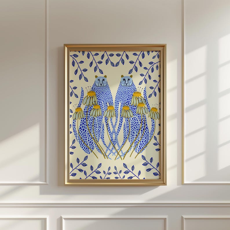 May include: A framed illustration of two blue leopards with yellow spots standing in a field of white flowers with yellow centres. The background is a cream colour with blue leaves.