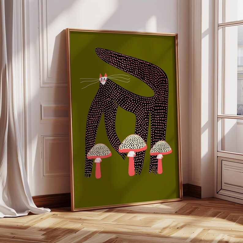 May include: A black cat with pink polka dots stands on a green background with three white and red mushrooms. The cat has a long tail and large eyes.