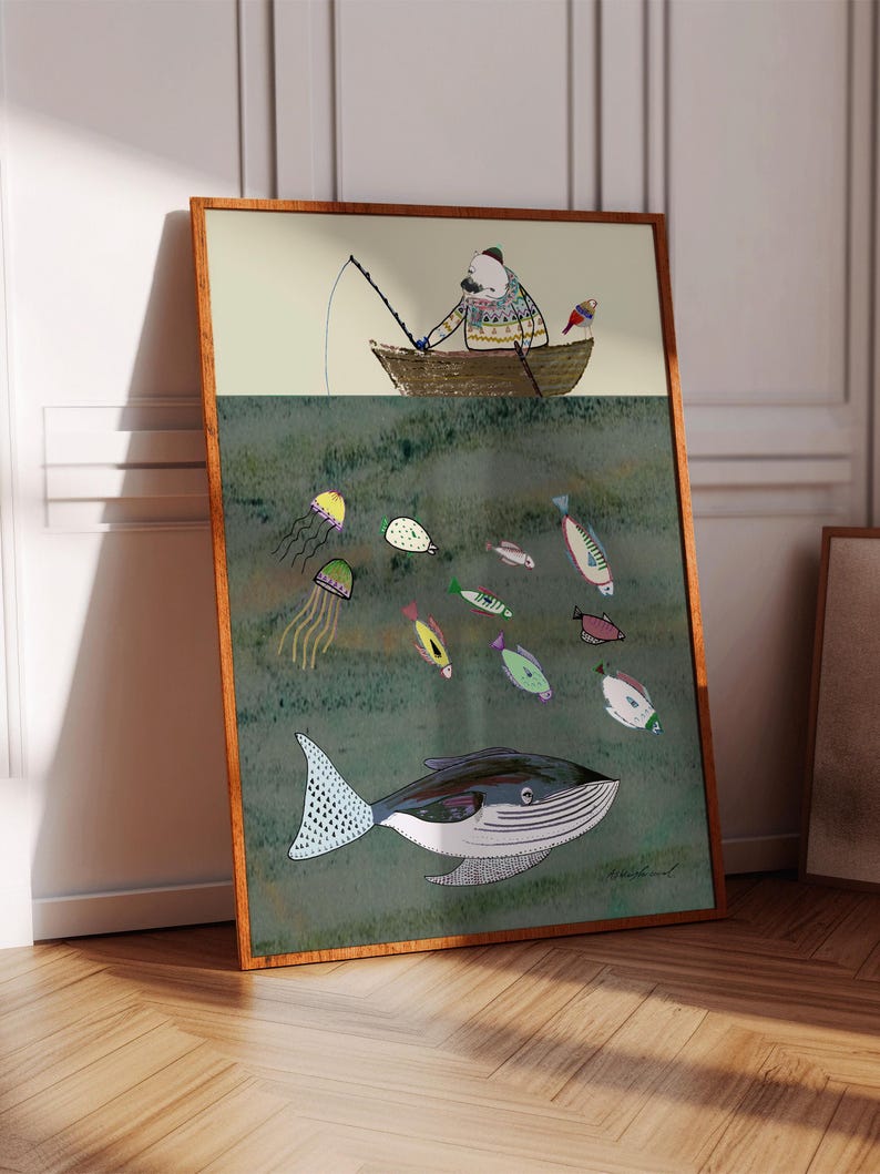 May include: A framed illustration of a person in a boat fishing with a whale and fish swimming below. The person is wearing a sweater and a hat. The boat is brown and the whale is blue and white. The fish are various colors and shapes. The background is a green watercolor wash.