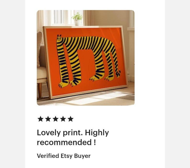 May include: A rectangular framed wall art print featuring a stylized, long-bodied creature with black vertical stripes on a vibrant orange background. The creature has four legs, a small head with ears, and a tail, all rendered in a bold, graphic style.