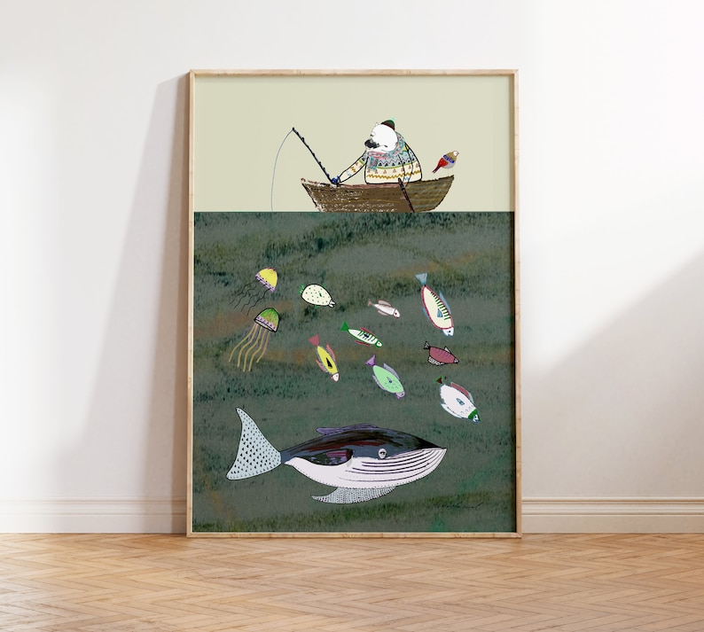 May include: A framed illustration of a bear in a boat fishing. The bear is wearing a striped sweater and a hat. The boat is brown and has a fishing rod sticking out of it. There are fish and jellyfish in the water below the boat. A whale is swimming in the water below the boat. The background is a light green color.