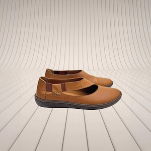 Handmade leather flats in caramel brown