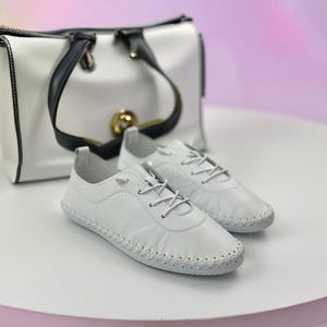 White leather shoes with lace-up design