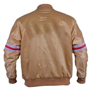 Back view of gold satin bomber jacket – classic varsity style with striped sleeves and ribbed hem